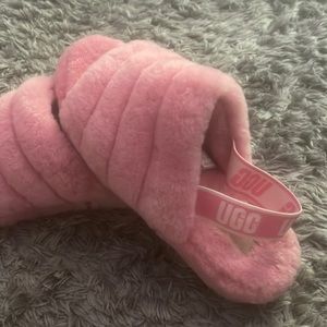 Comfy pink Ugg slippers. Only worn outside for about 15 minutes.